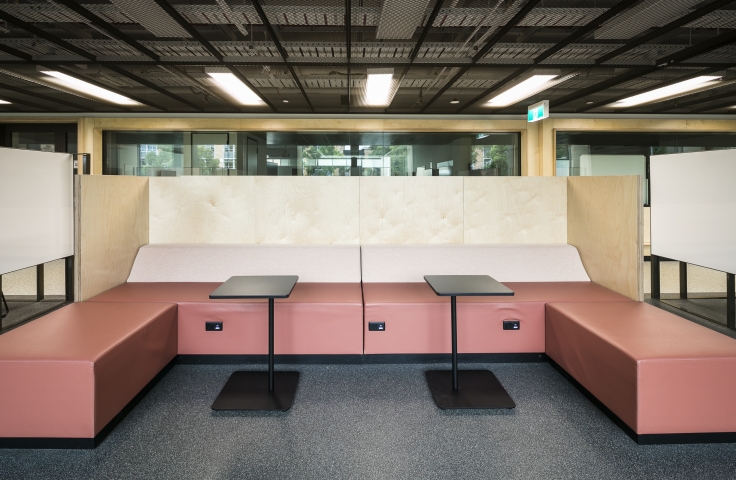 UNSW Electrical Engineering student study spaces with pink lounge and black tables
