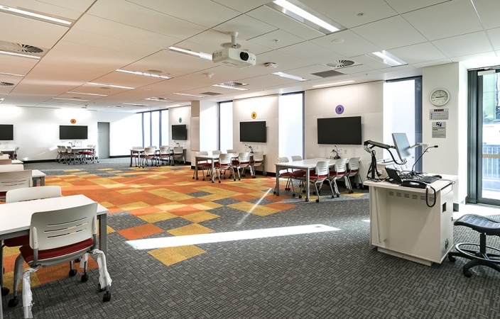 UNSW teaching space with white chairs and tables