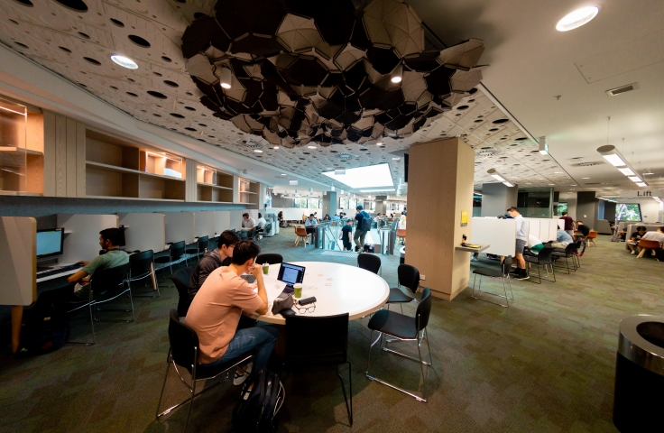 UNSW Law Library with round white tables and geometric light